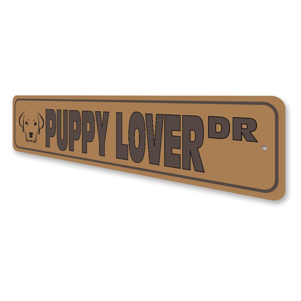 A colorful Puppy Street Sign made of durable aluminum, featuring a playful dog design, perfect for home decor.