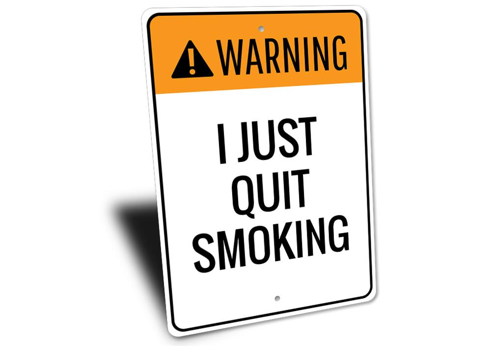 A decorative Quit Smoking Sign made of durable aluminum, featuring customizable text and pre-drilled holes for easy mounting.