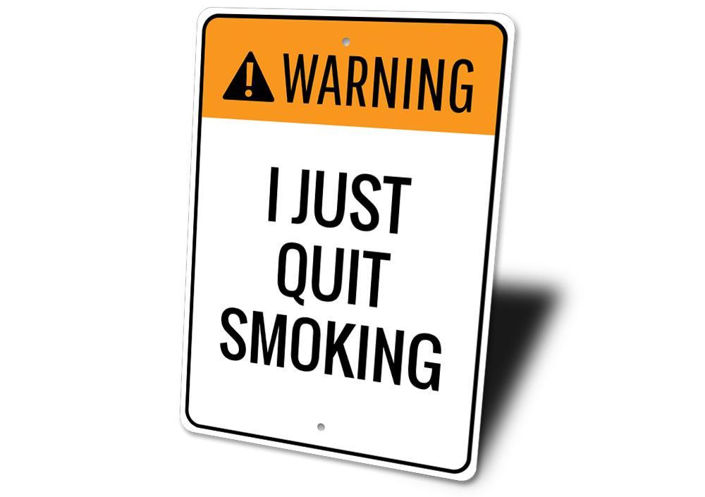 A decorative Quit Smoking Sign made of durable aluminum, featuring customizable text and pre-drilled holes for easy mounting.