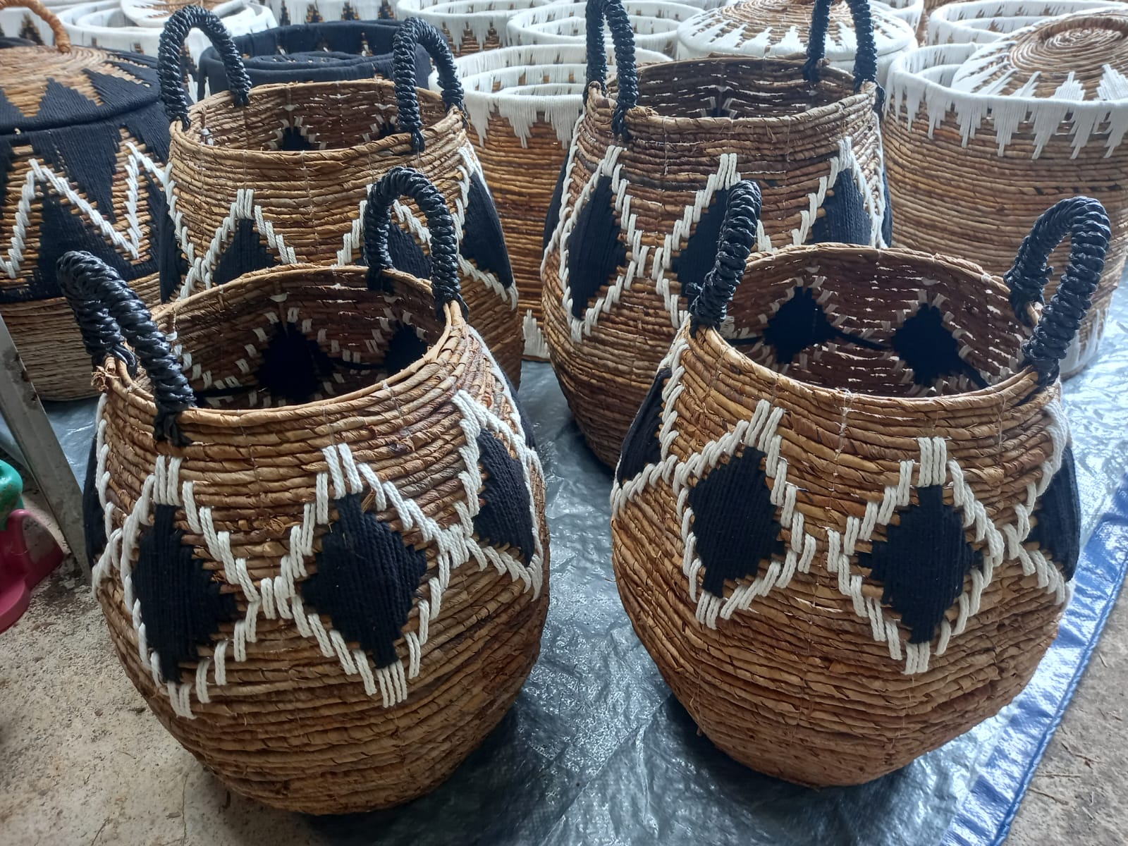 Railaco Basket - S, a small oval cotton basket with natural handles, ideal for home organization and decor.