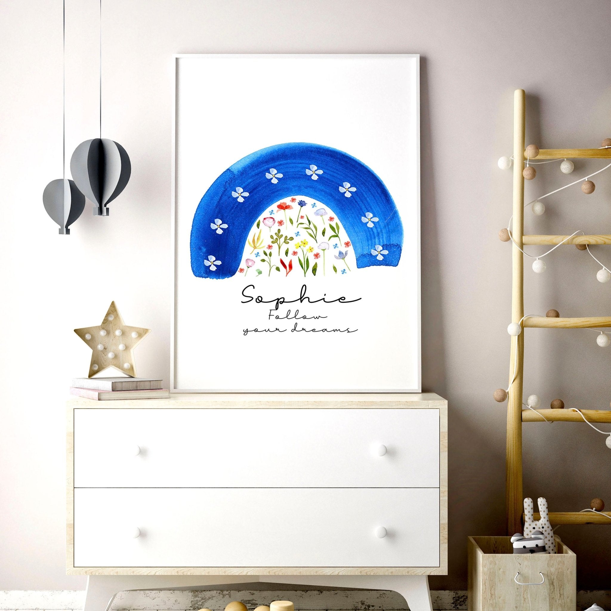 A beautiful watercolour floral rainbow wall art print in soft blue tones, perfect for nursery decoration.