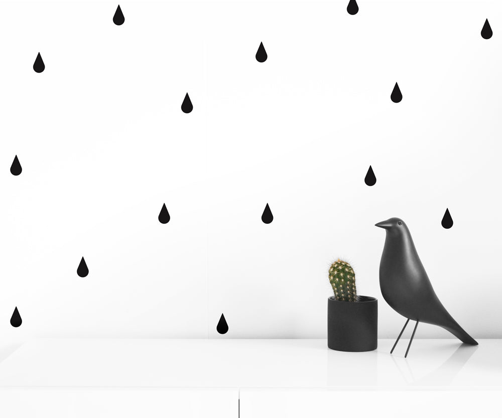 A collection of Raindrops Wall Decals in black and gray, showcasing their easy application and stylish design.