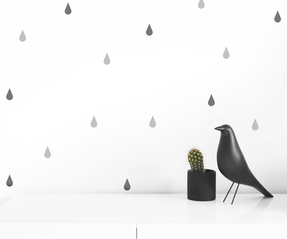 A collection of Raindrops Wall Decals in black and gray, showcasing their easy application and stylish design.