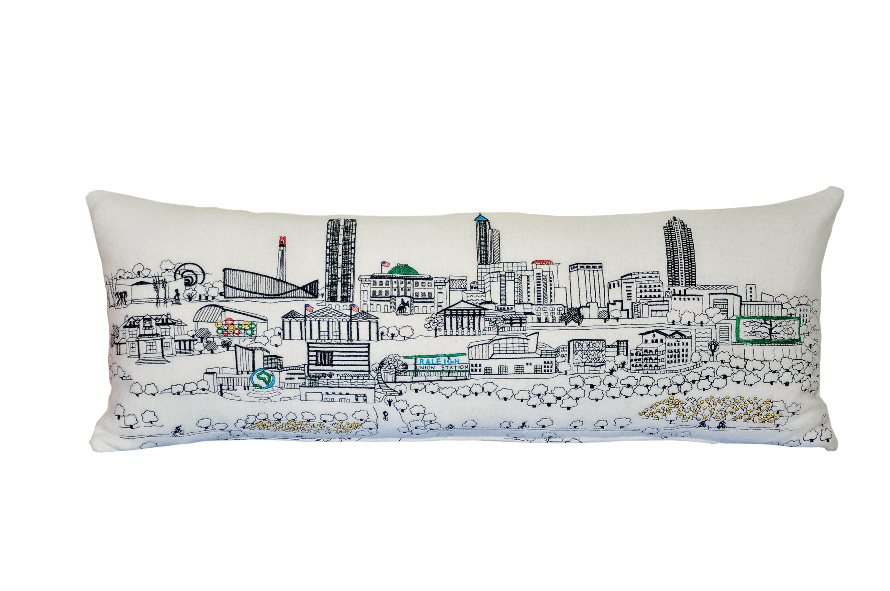 Raleigh Pillow featuring vibrant wool embroidery inspired by North Carolina's capital, with a red zipper at the bottom.