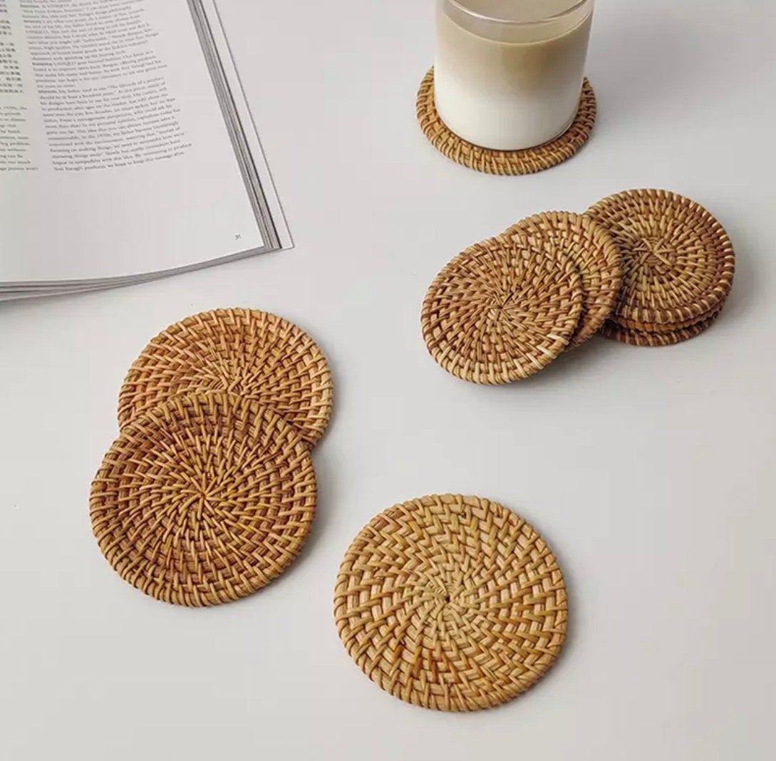 Set of 4 handmade rattan coasters, showcasing their natural texture and elegant design, perfect for table décor.