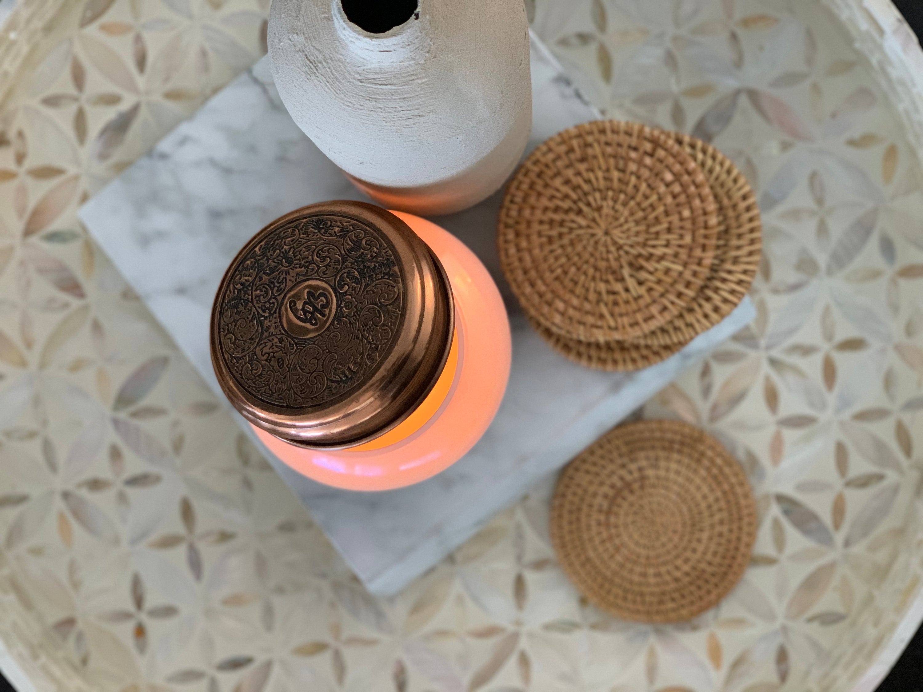 Set of 4 handmade rattan coasters, showcasing their natural texture and elegant design, perfect for table décor.