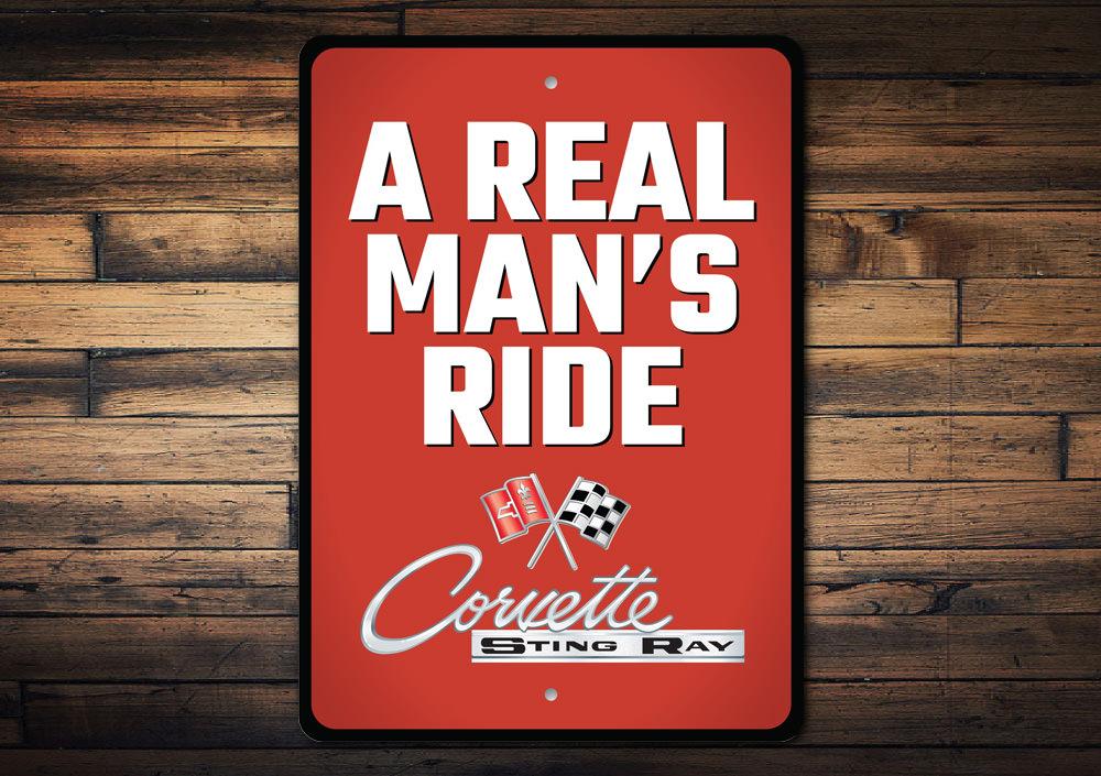 Real Man's Ride Corvette Sign made of durable aluminum, featuring vibrant colors and a classic design, perfect for car enthusiasts.