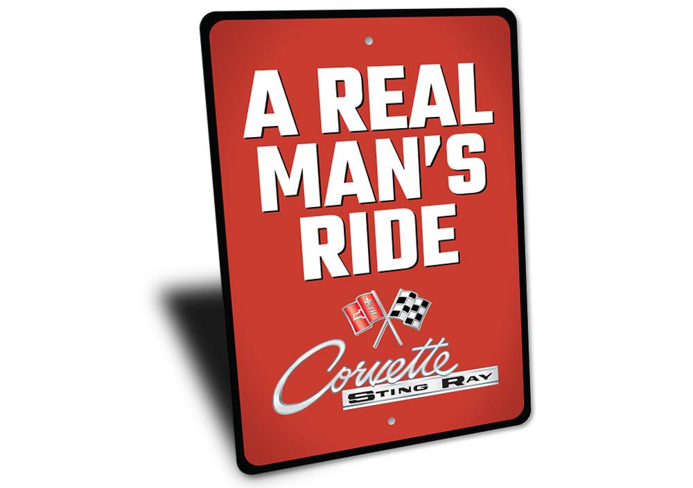 Real Man's Ride Corvette Sign made of durable aluminum, featuring vibrant colors and a classic design, perfect for car enthusiasts.