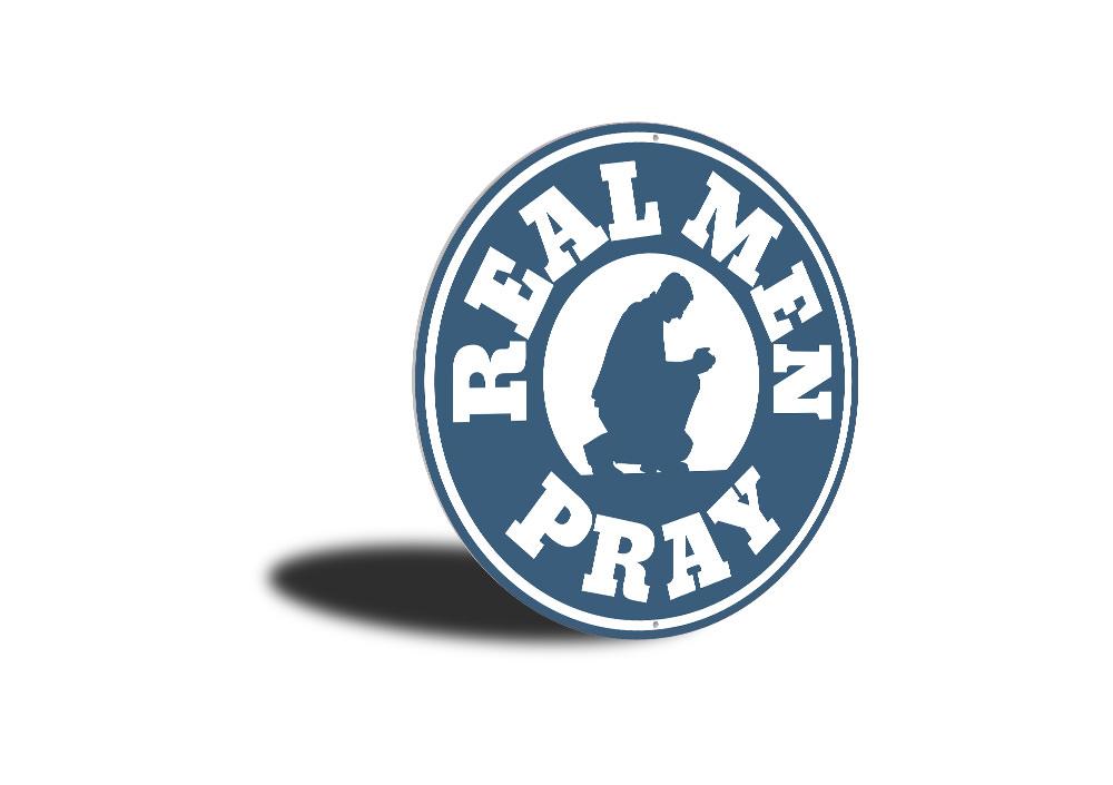 Real Men Pray Sign made of aluminum, featuring a bold design suitable for home decor.