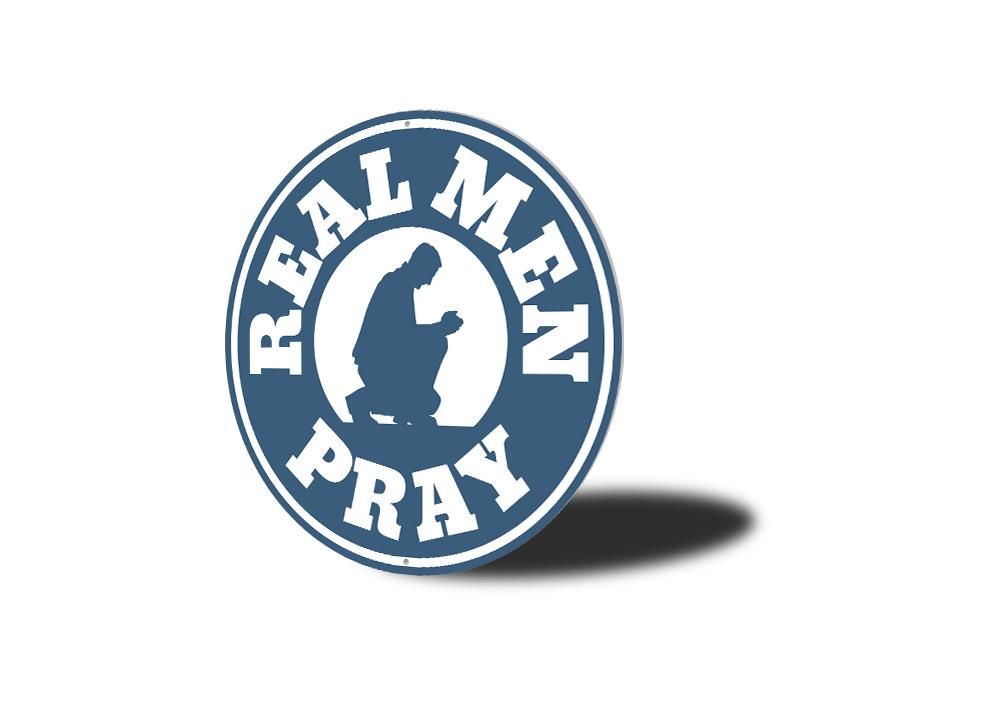 Real Men Pray Sign made of aluminum, featuring a bold design suitable for home decor.