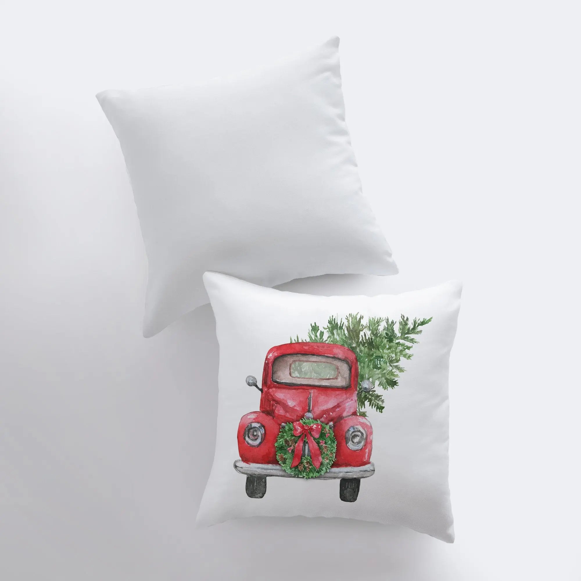 Red Christmas Truck Pillow Cover featuring a vintage truck hauling a Christmas tree and wreath, set against a white background.