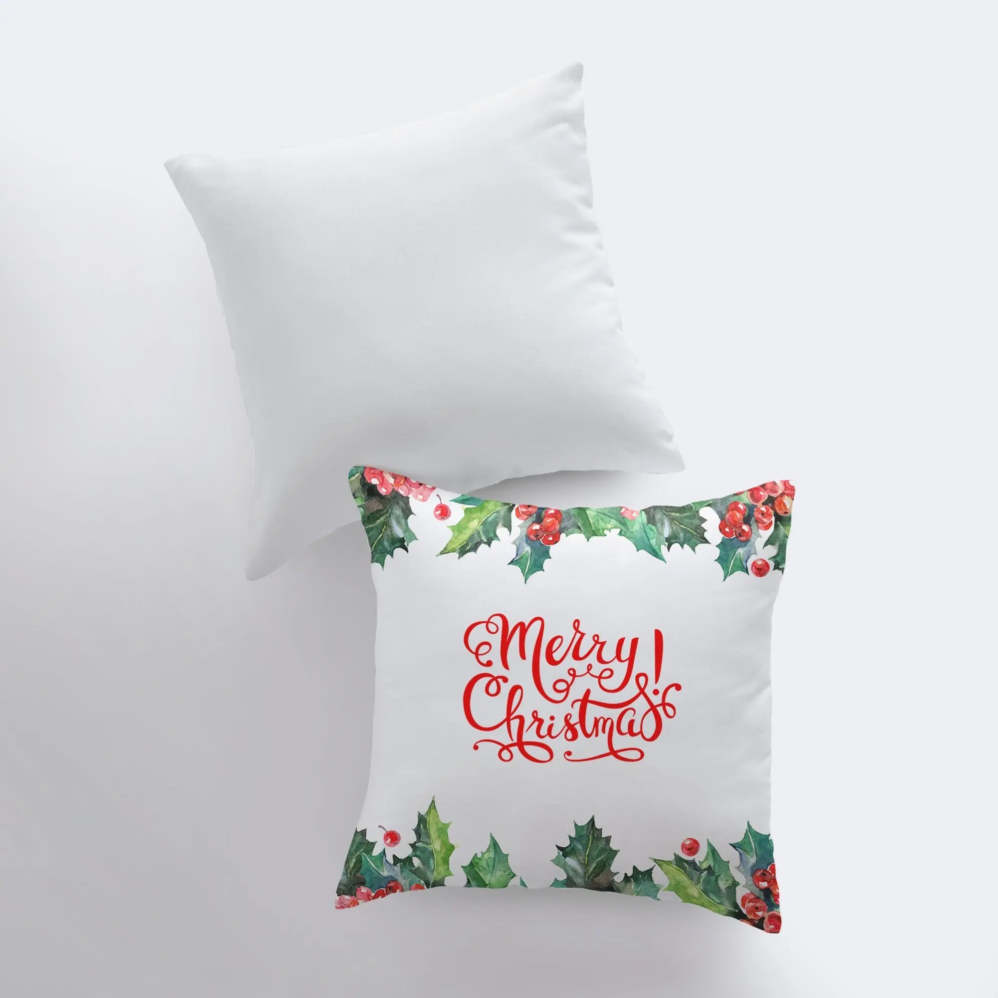 Red Merry Christmas Holly pillow cover featuring elegant cursive text and holly berry design on a white background.