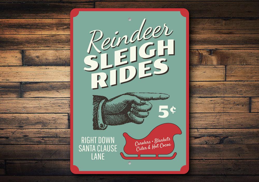 A festive Reindeer Sleigh Rides Sign made of high-quality aluminum, featuring a charming design perfect for Christmas decorations.