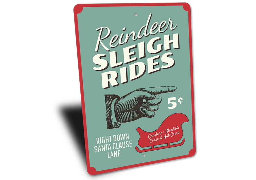 A festive Reindeer Sleigh Rides Sign made of high-quality aluminum, featuring a charming design perfect for Christmas decorations.