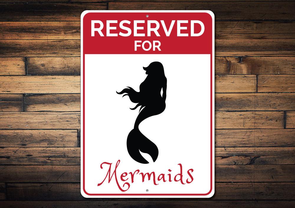 Reserved Mermaids Parking Sign made of durable aluminum with a whimsical mermaid design, featuring pre-drilled holes for easy mounting.