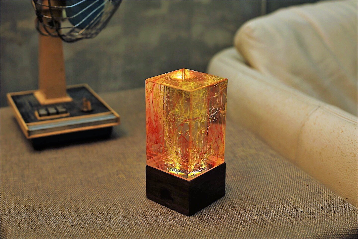 Handcrafted resin table decor featuring solar-powered LED lights in a unique design, showcasing warm white illumination.