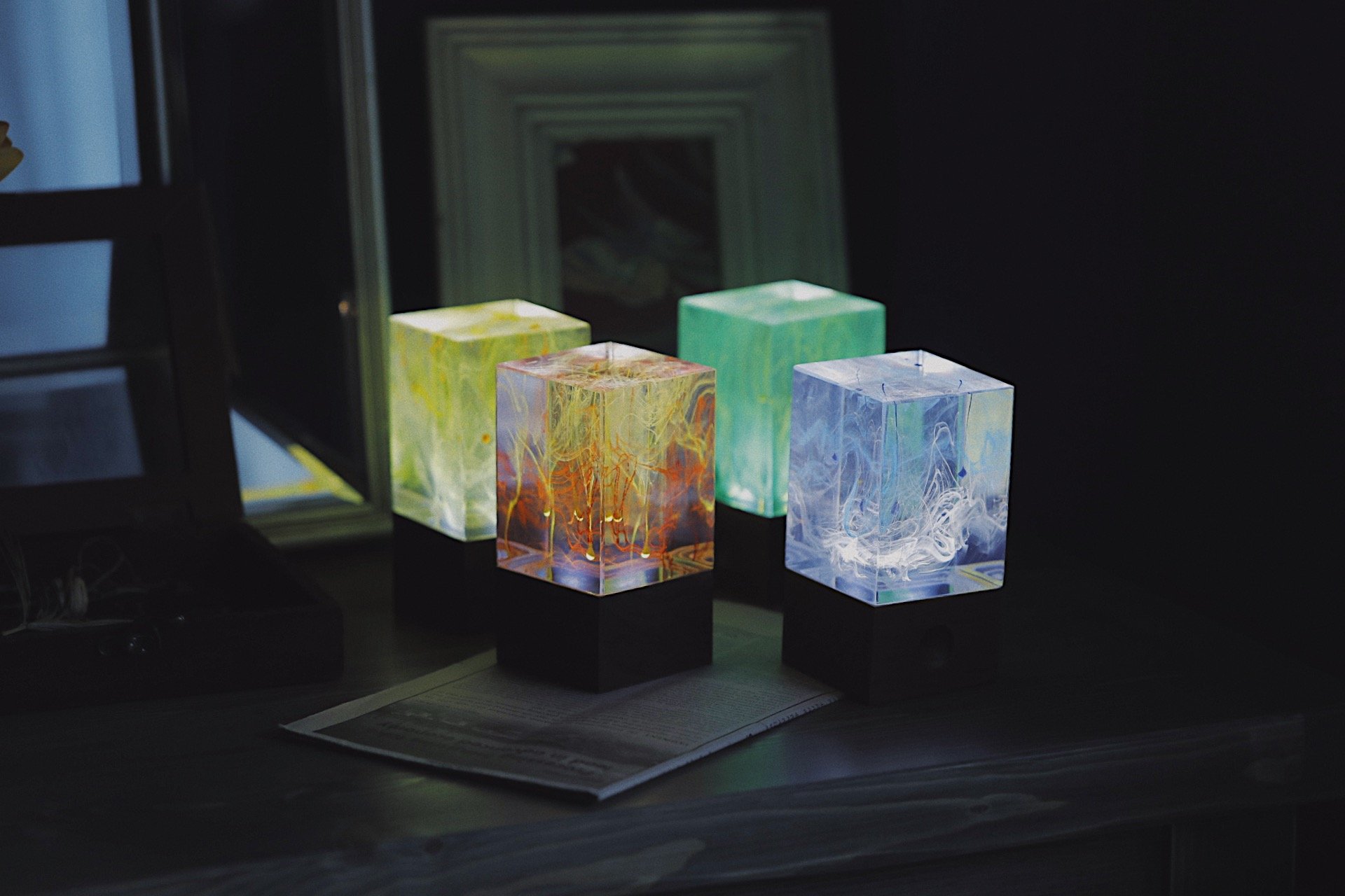 Handcrafted resin table decor featuring solar-powered LED lights in a unique design, showcasing warm white illumination.