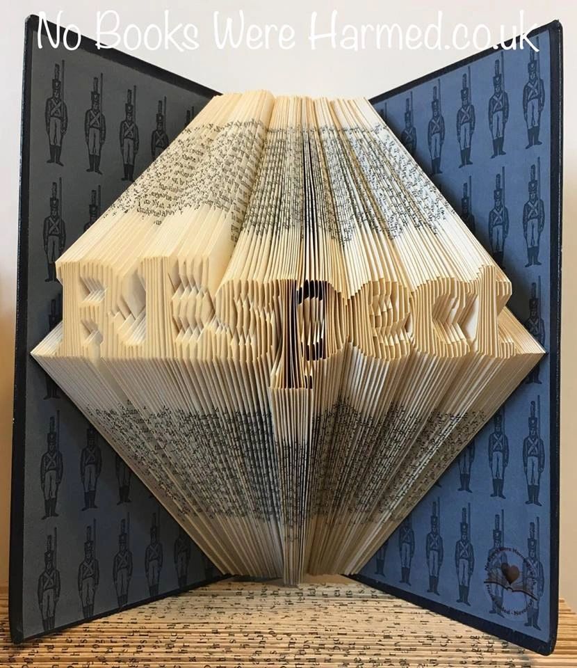 Hand-folded book art titled 'REspect', showcasing intricate designs made from vintage books, symbolizing remembrance for the Royal Engineers.