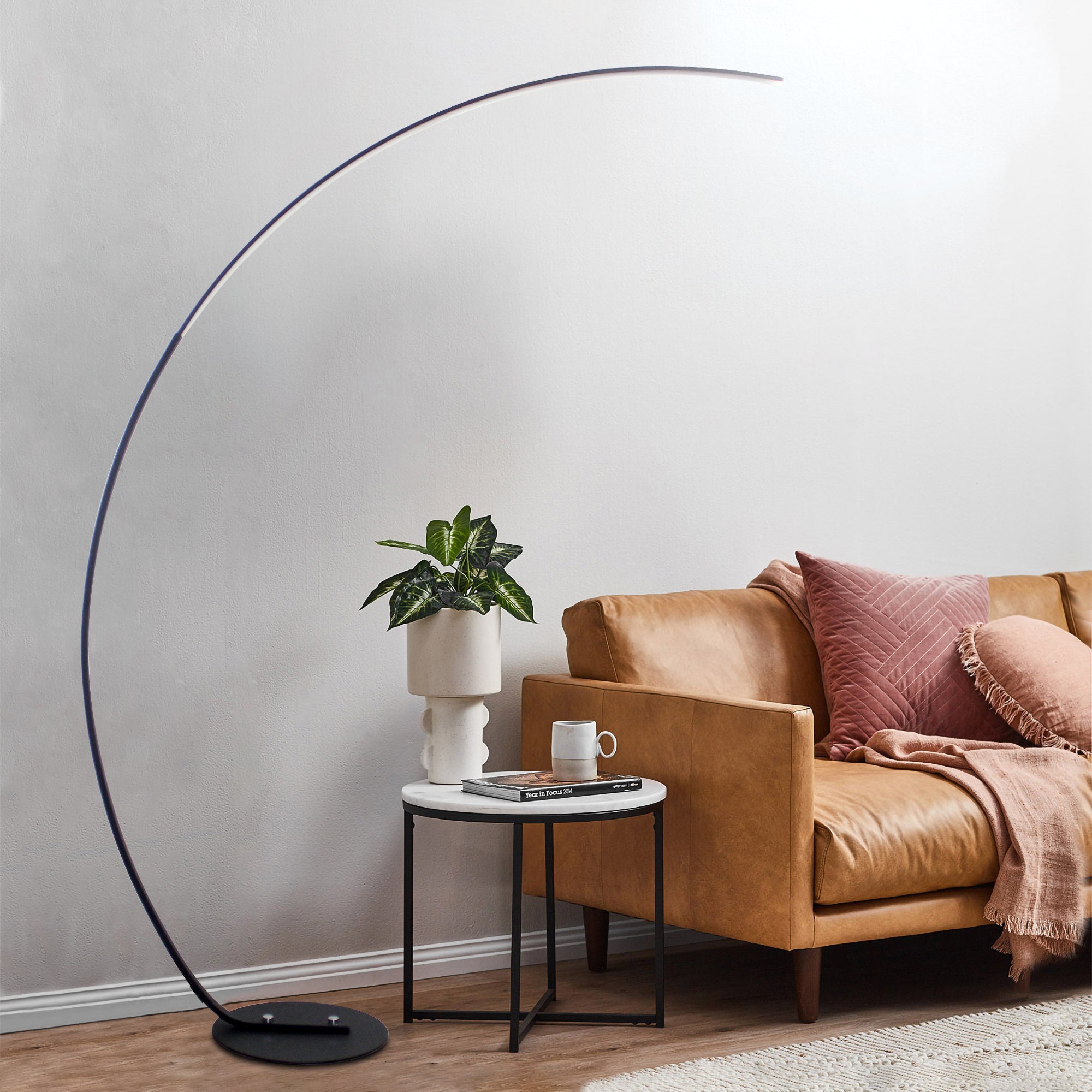 RGBW Modern Curve Floor Lamp in black, showcasing its sleek design and vibrant color options.