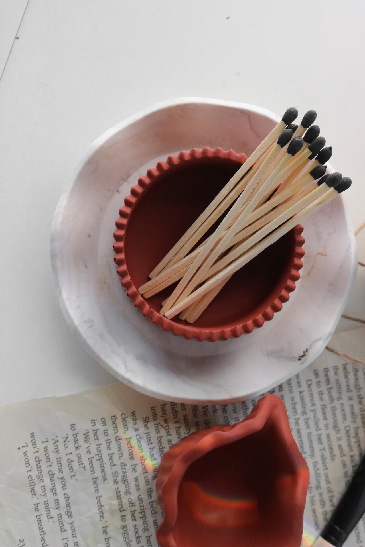 A beautifully crafted ribbed trinket dish made from jesmonite, showcasing unique handmade finishes and a delicate design.