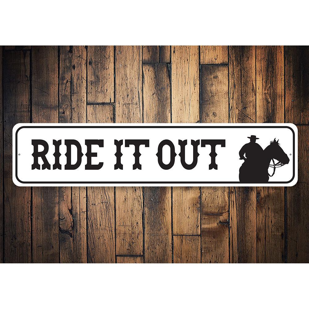 A decorative Ride It Out Sign made of high-quality aluminum, featuring a rustic design suitable for barns and farmhouse decor.