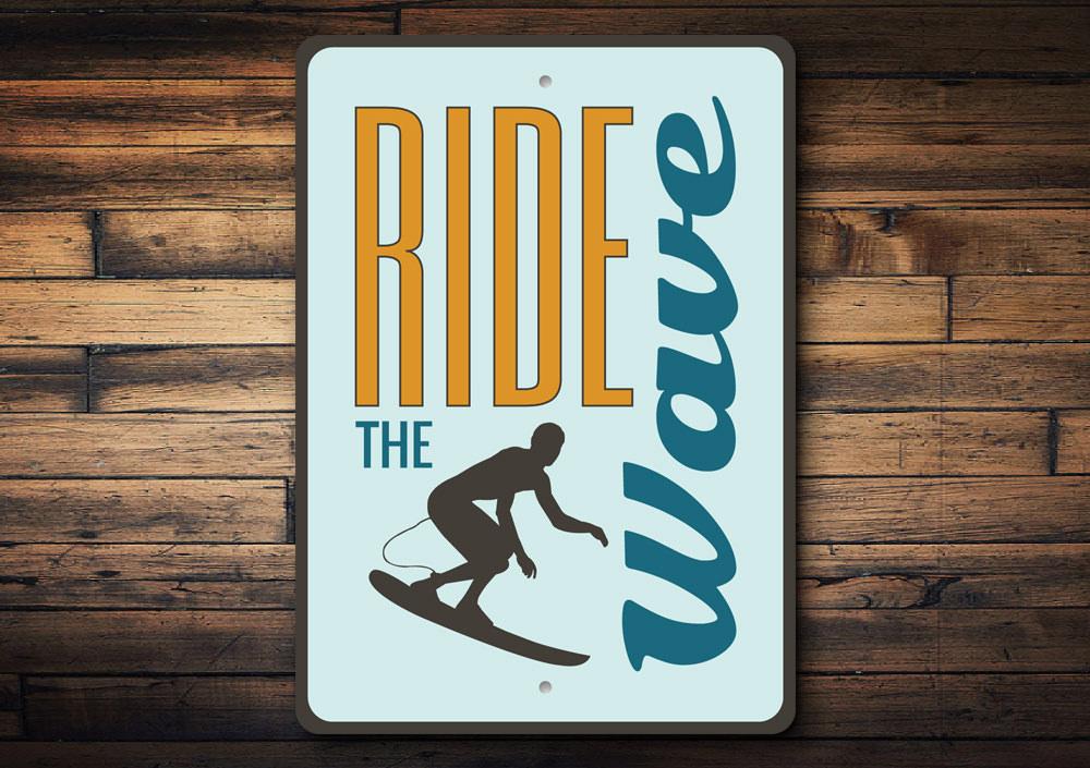 Custom Ride the Wave sign made of durable aluminum, featuring beach-themed design, perfect for coastal decor.