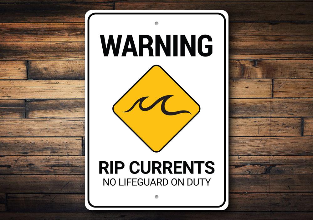 Rip Currents Warning Sign made of durable aluminum, featuring a beach-themed design, ideal for coastal decor.