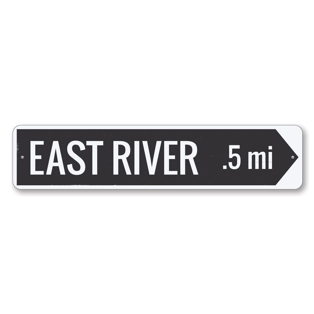 A decorative River Arrow Sign made of high-quality aluminum, featuring customizable text and pre-drilled holes for easy mounting.