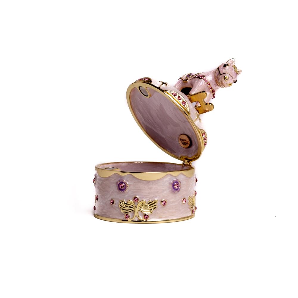 A beautifully crafted Rocking Horse Music Box, featuring enamel painting and adorned with sparkling Austrian crystals, plated in 24K gold.