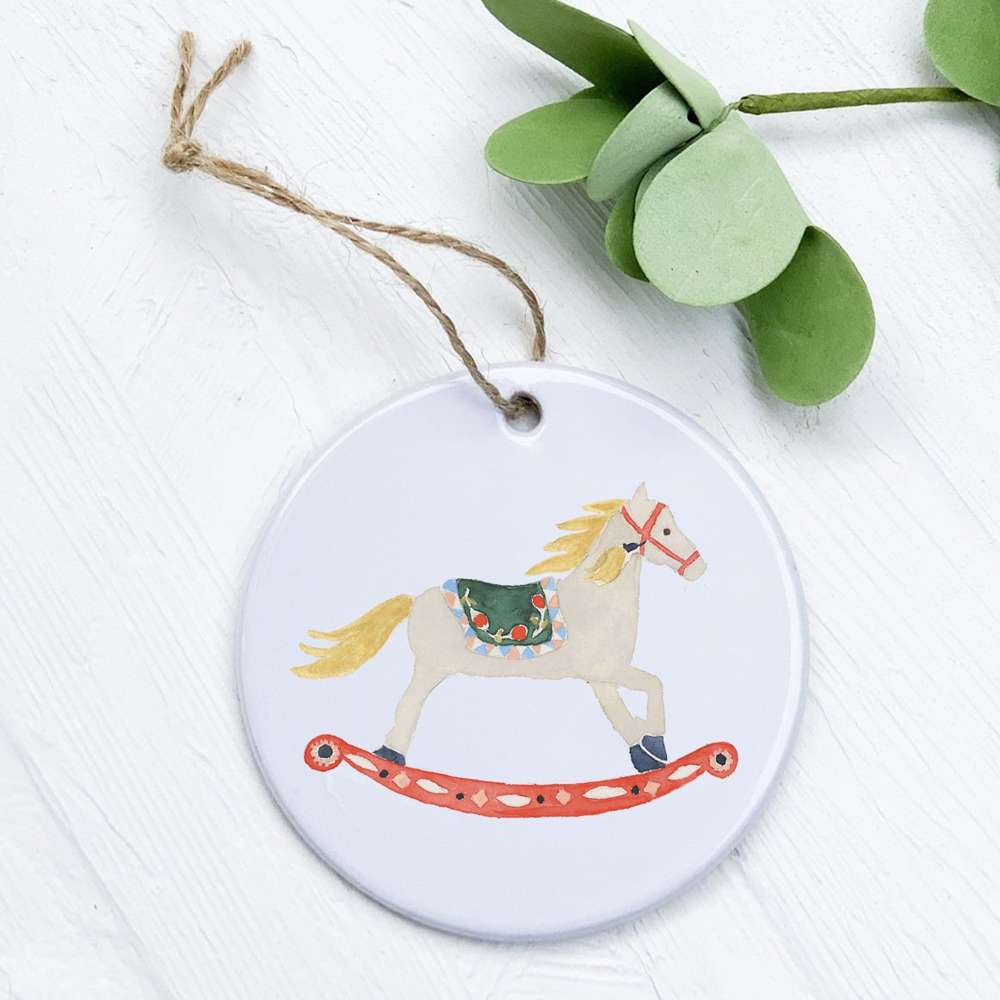 A beautifully crafted porcelain Rocking Horse Ornament with a vibrant design, perfect for gifting or home decor.