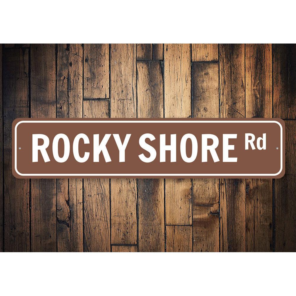 Rocky Shore Road Sign made of high-quality aluminum, featuring a coastal design perfect for beach-themed decor.