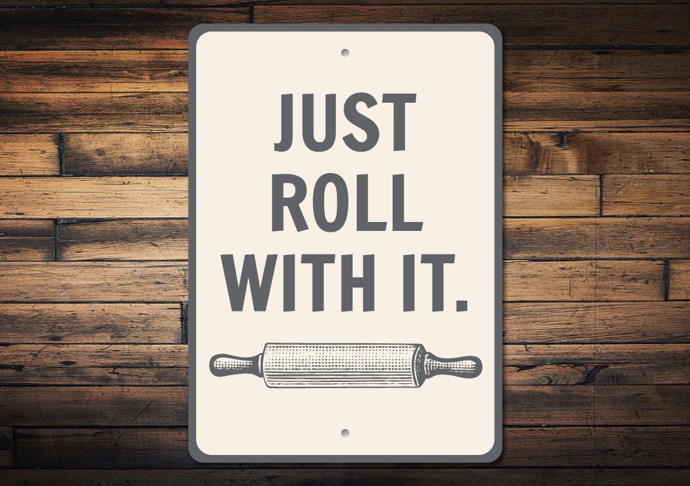 A customizable Roll With It Sign made of high-quality aluminum, featuring a stylish design suitable for various rooms.