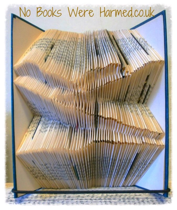 Rolling Hills art piece made from hand-folded pages of vintage books, showcasing intricate designs and unique textures.