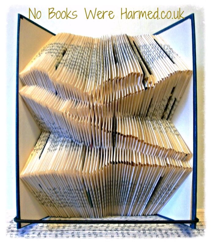 Rolling Hills art piece made from hand-folded pages of vintage books, showcasing intricate designs and unique textures.