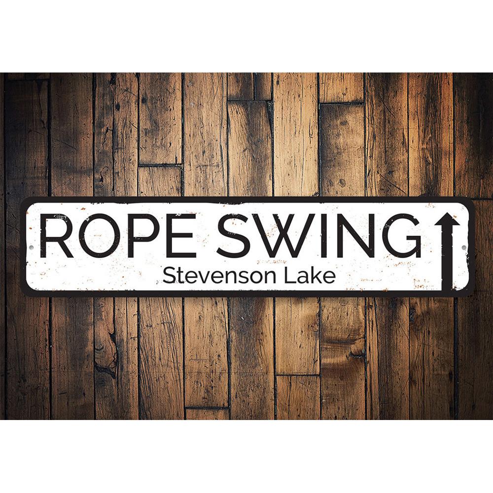 A decorative Rope Swing Sign made of durable aluminum, showcasing a rustic design perfect for lakehouse decor.