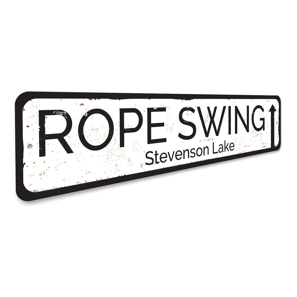 A decorative Rope Swing Sign made of durable aluminum, showcasing a rustic design perfect for lakehouse decor.