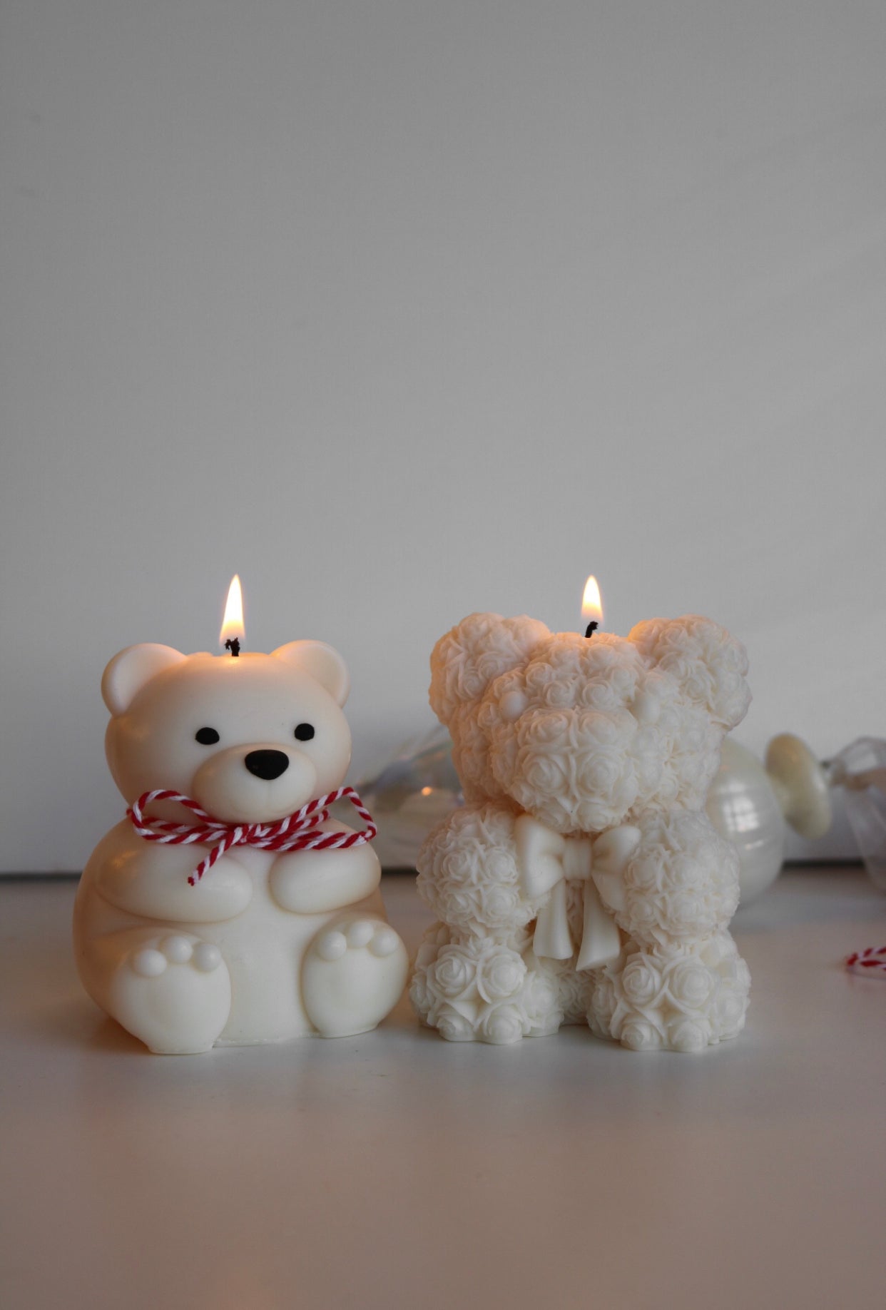 A beautifully crafted Rose bear candle, shaped like a bear and made from a soy wax blend, showcasing intricate details and a charming design.