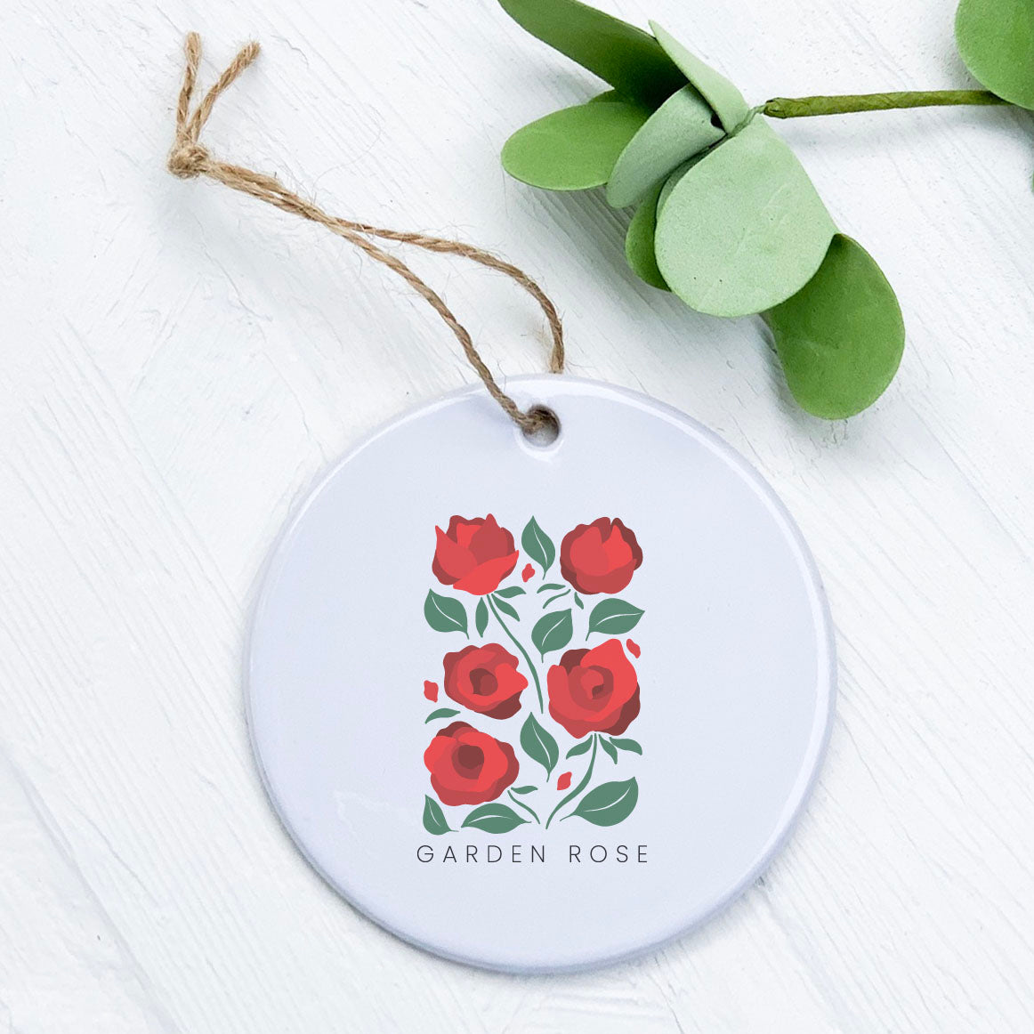 A beautifully crafted porcelain ornament featuring a vibrant rose design, perfect for home decor or gifting.