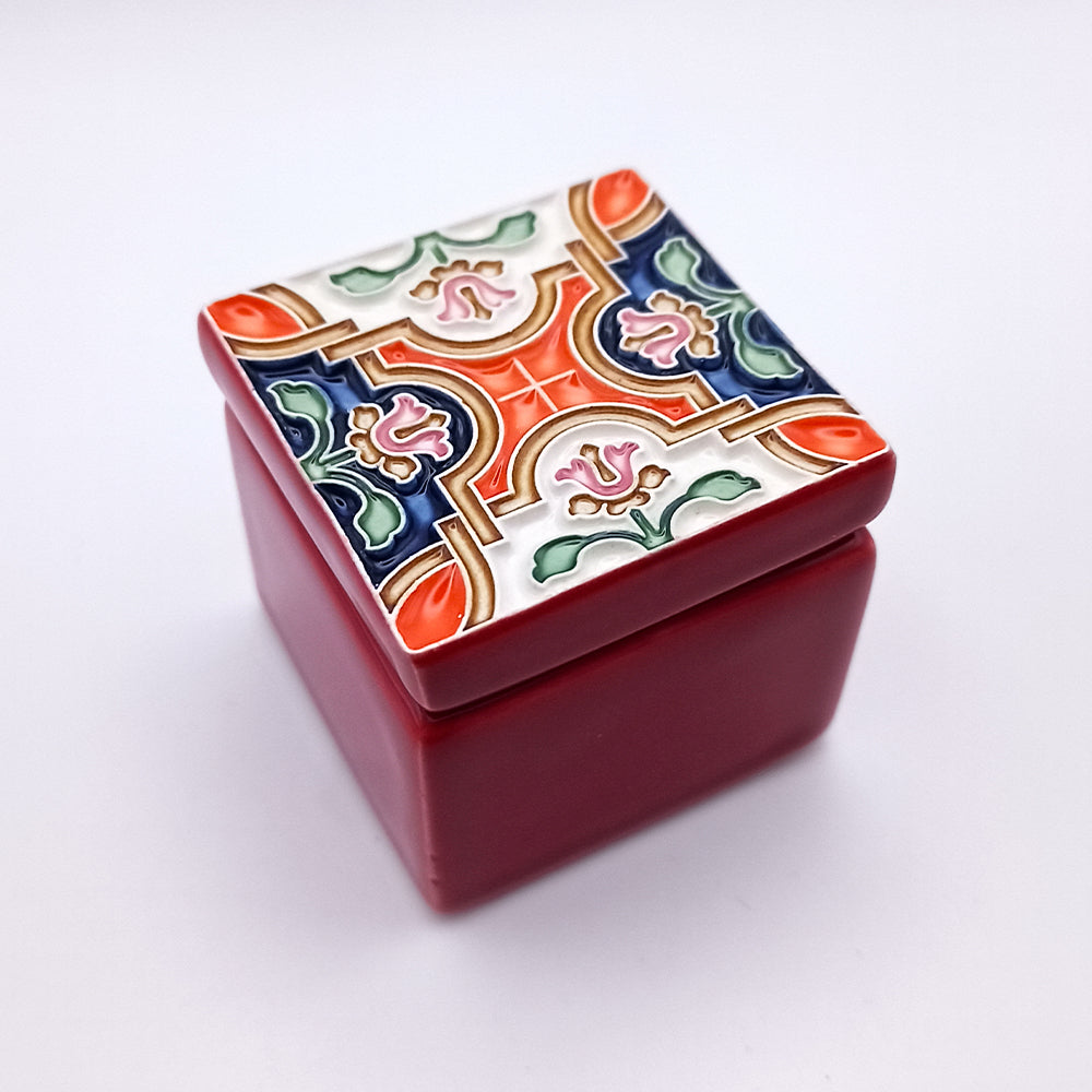 A beautifully handcrafted Rossio Ceramic Box featuring intricate designs and vibrant colors, perfect for home decor.