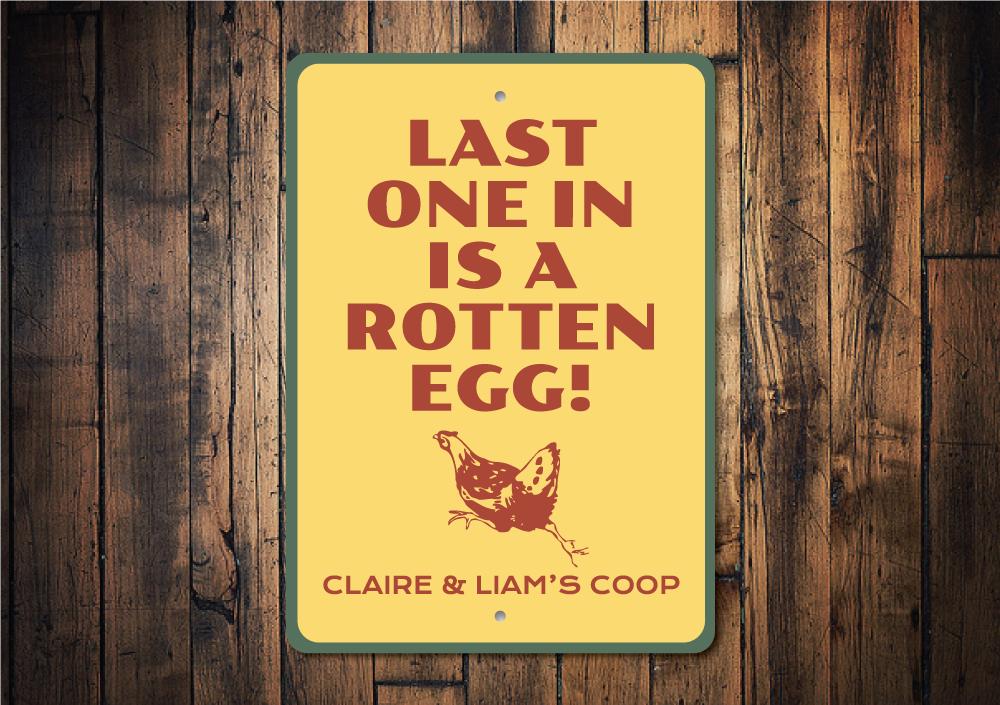 A decorative Rotten Egg Sign made of high-quality aluminum, featuring humorous text and vibrant colors, perfect for home decor.