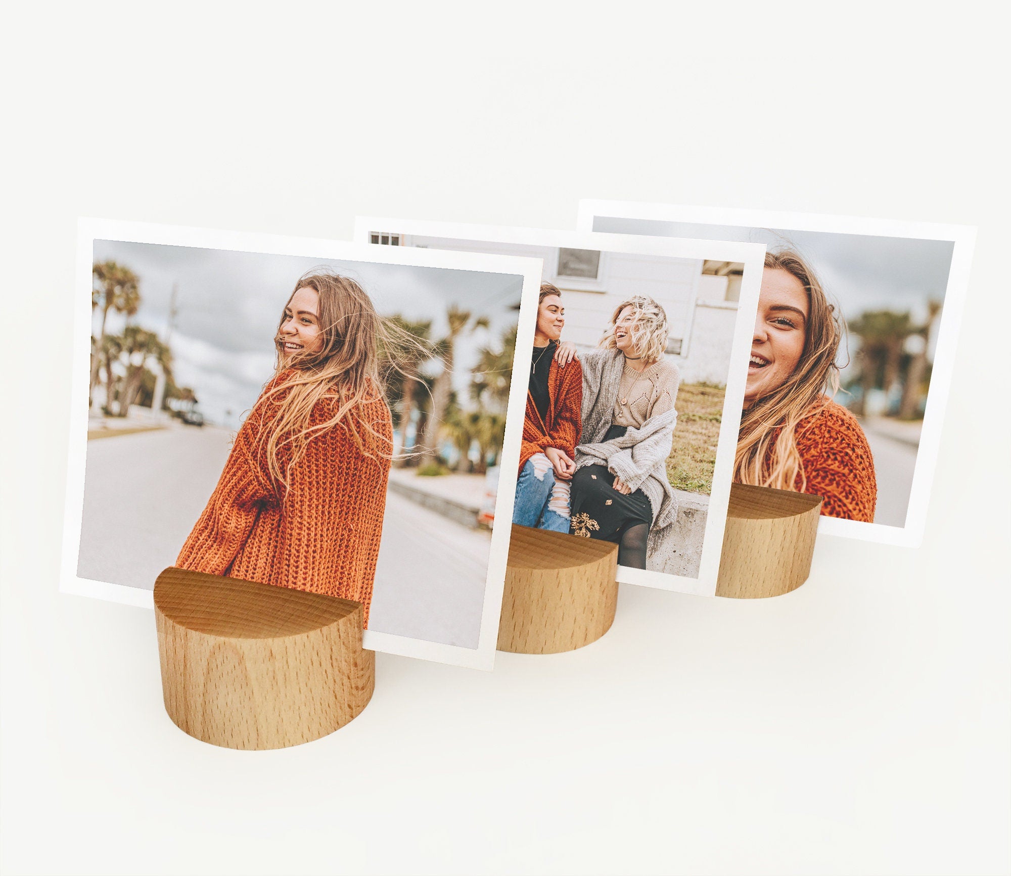 A handcrafted Round Wood Card Holder made from eco-friendly wood, displaying a small photo and showcasing its natural finish.