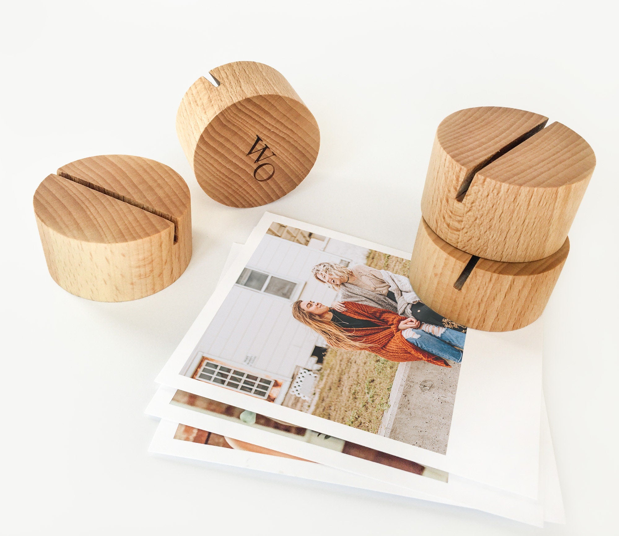 A handcrafted Round Wood Card Holder made from eco-friendly wood, displaying a small photo and showcasing its natural finish.