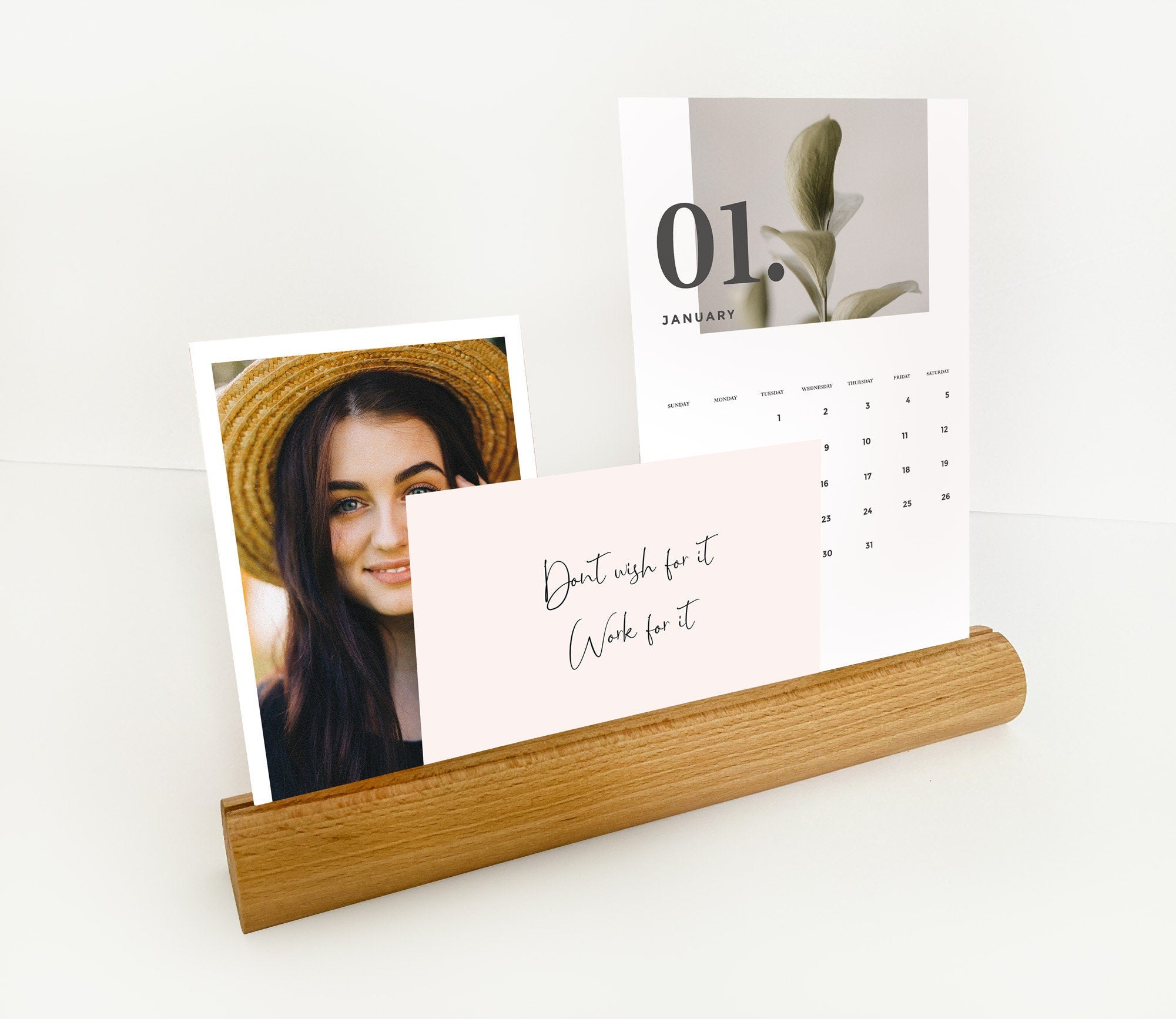 A stylish Round Wood Photo Ledge displaying various photos and notes, handcrafted from eco-friendly wood.