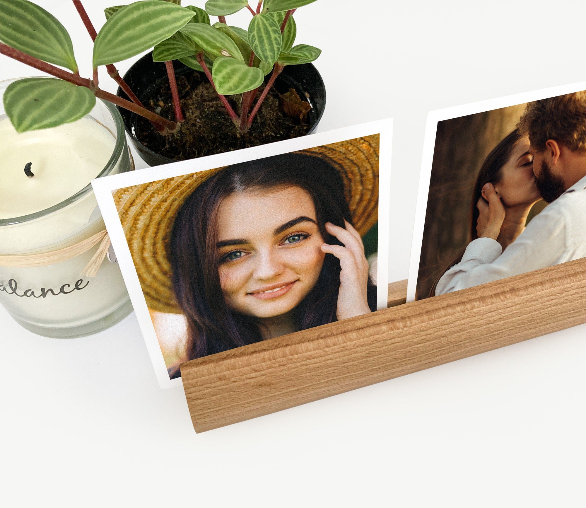 A stylish Round Wood Photo Ledge displaying various photos and notes, handcrafted from eco-friendly wood.