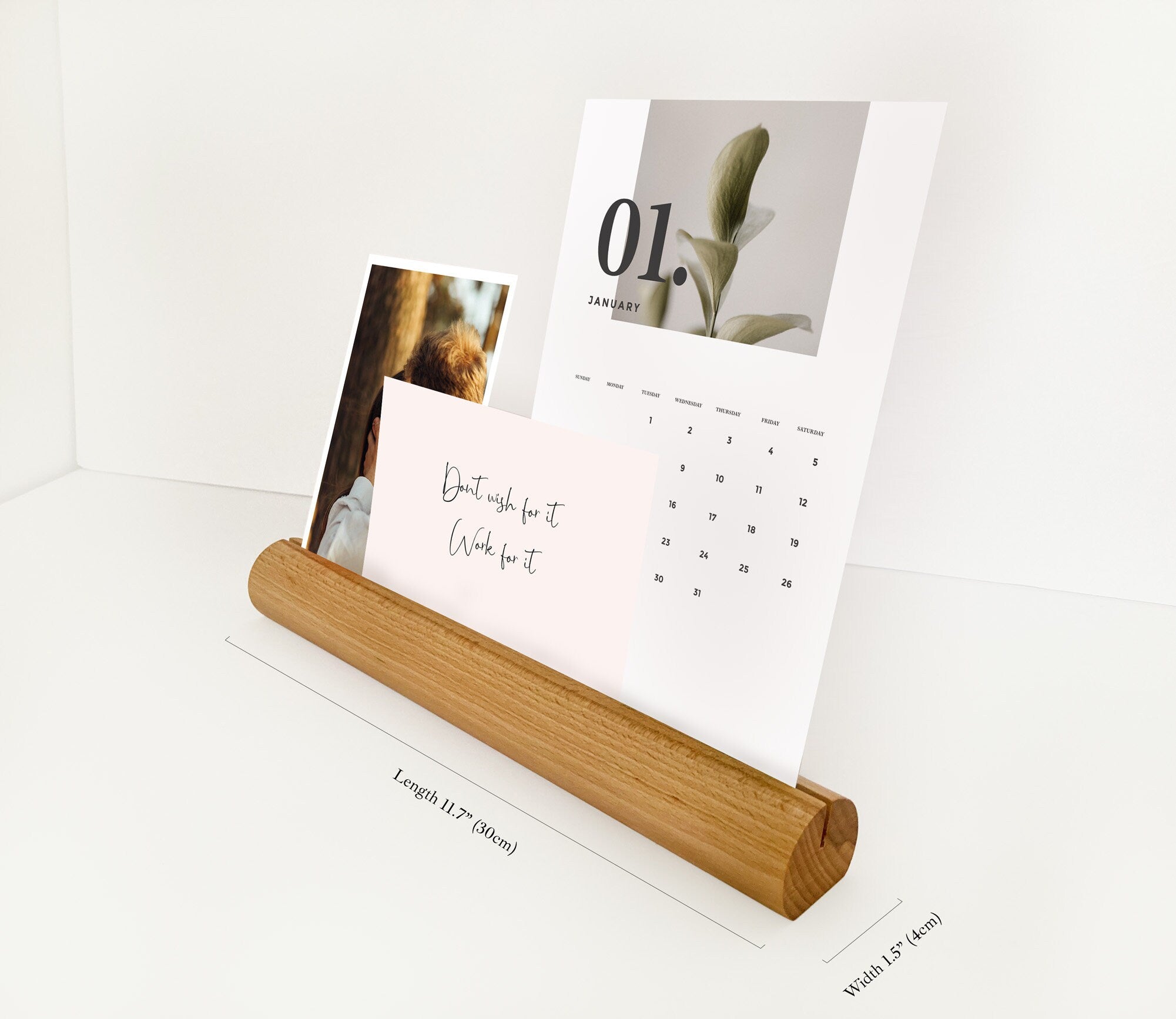 A stylish Round Wood Photo Ledge displaying various photos and notes, handcrafted from eco-friendly wood.