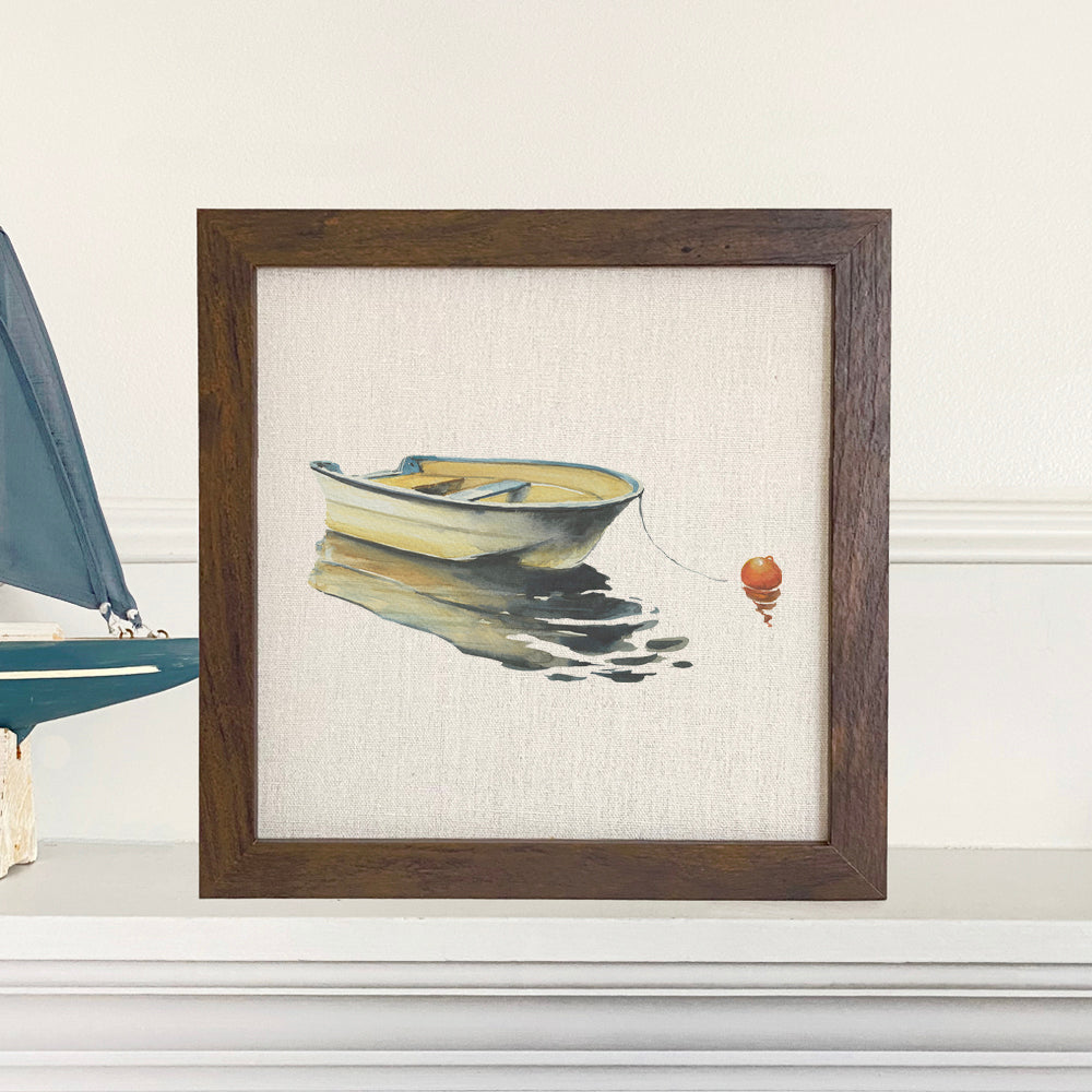 Framed sign featuring a serene rowboat on still water, with a natural wood frame and linen-look background.