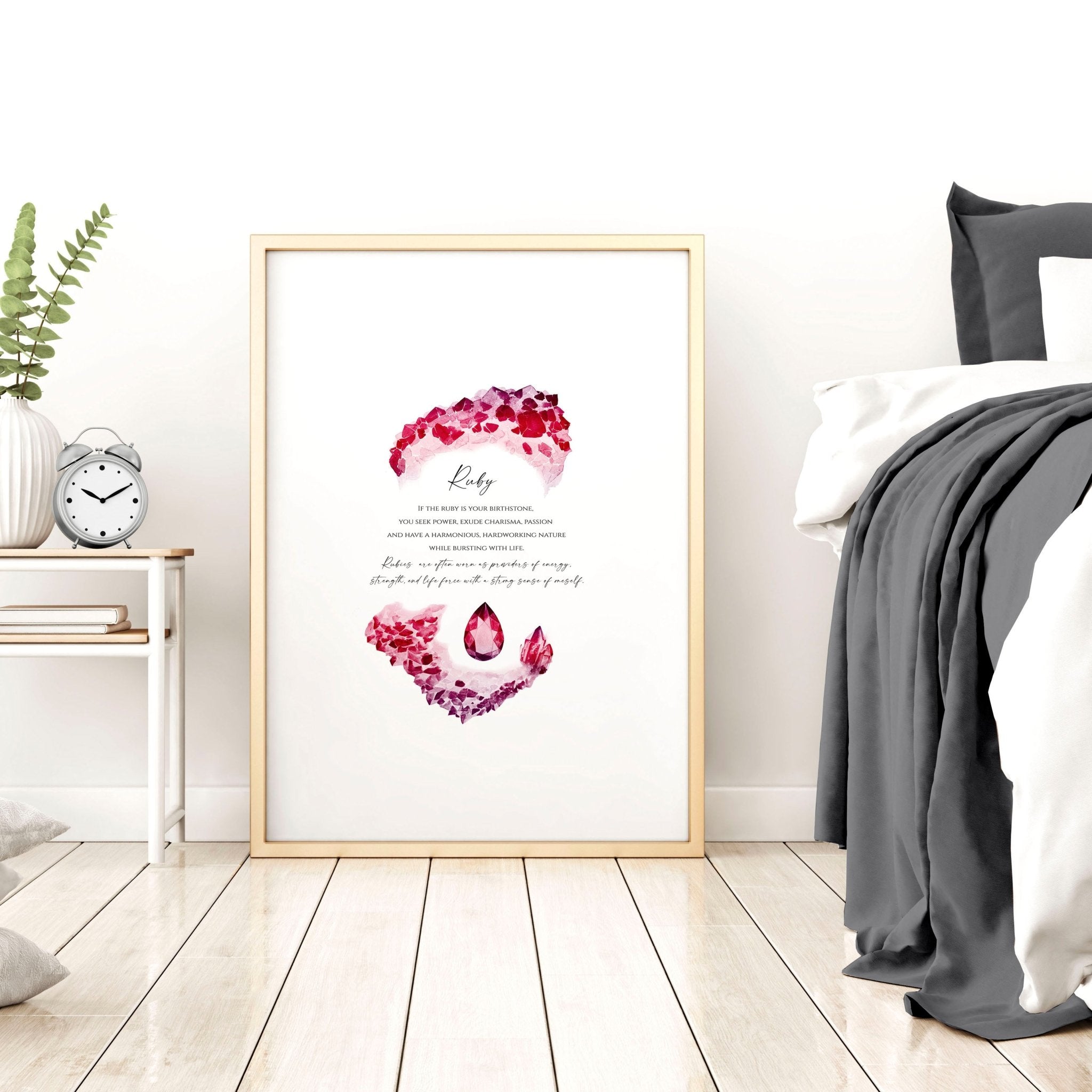 Framed wall art print featuring a vibrant ruby birthstone design, showcasing deep red hues and sparkling facets.