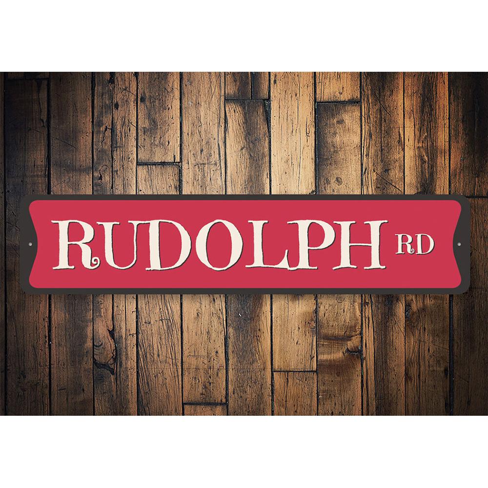 Rudolph Road Holiday Sign featuring festive Christmas design, made from high-quality aluminum, perfect for holiday decorations.