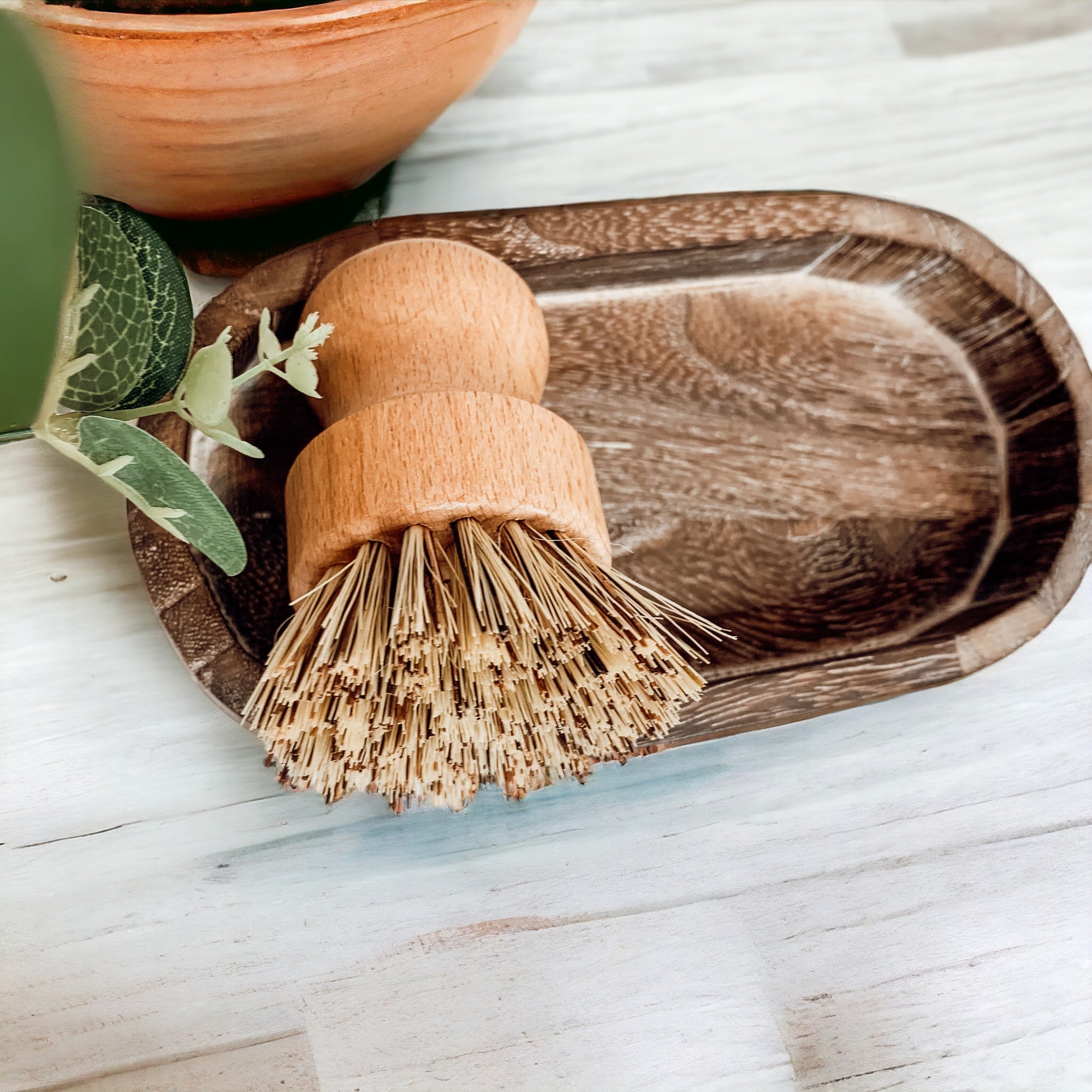 A rustic wood tray made from Paulownia wood, featuring white distressed details, ideal for home decor and organization.