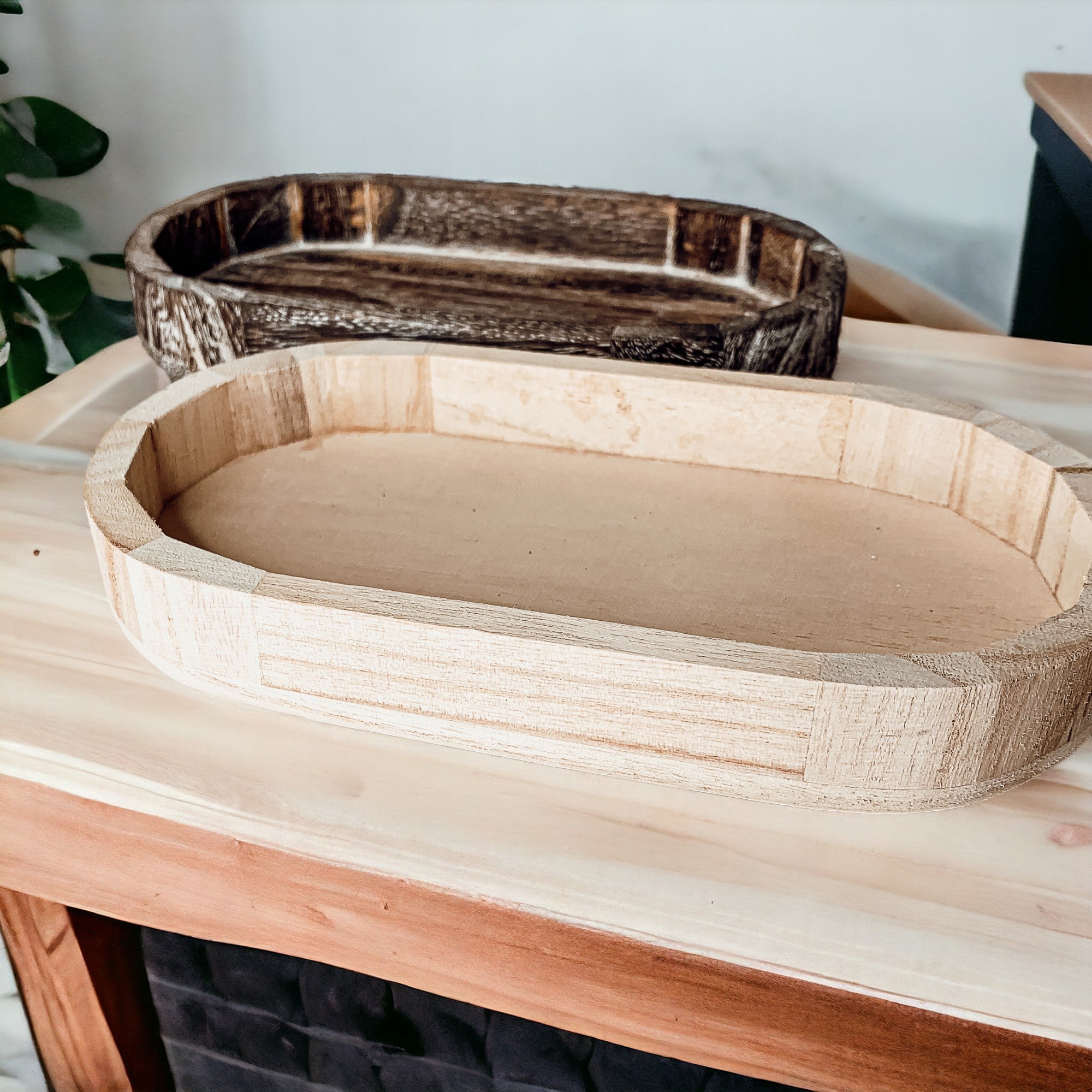 A rustic wood tray made from Paulownia wood, featuring white distressed details, ideal for home decor and organization.